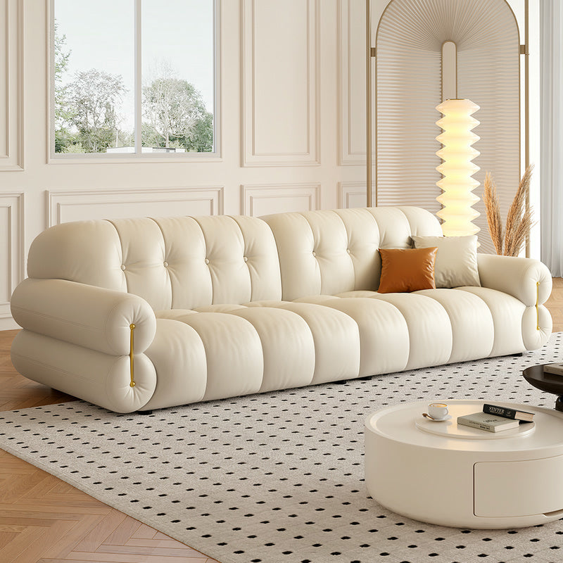 Cream Tufted Leather Sofa a€?Vintage-Inspired Puffy 3-Seater with Rolled Arms and Gold Accents