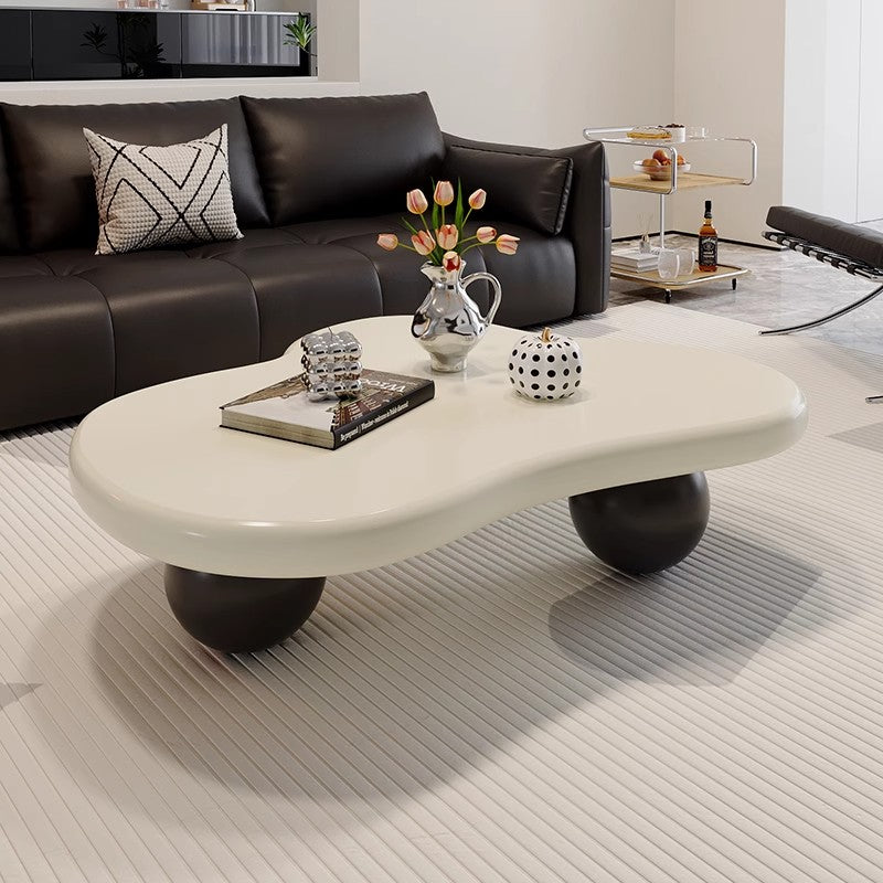 Modern Sculptural Coffee Table with Glossy Cream Irregular Top and Black Ball Legs a€?Artistic Center Table for Contemporary Living Room