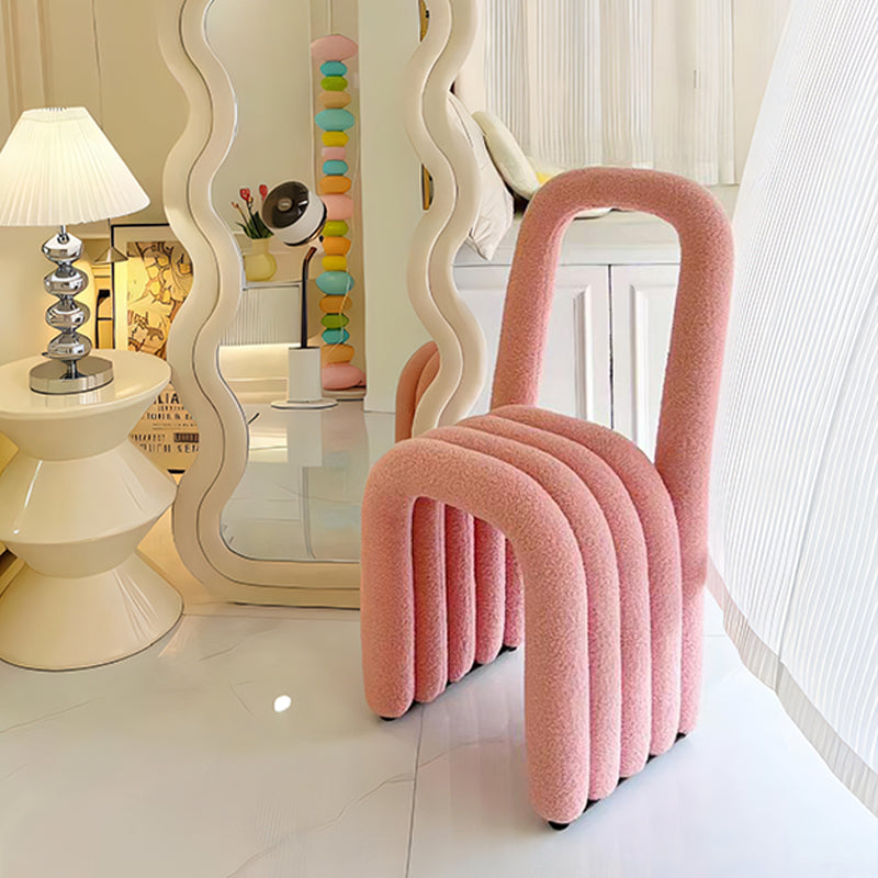Modern Sculptural Accent Chair in Pink Boucle with Curved Tube Design for Bedroom Dressing Area or Playful Contemporary Interiors
