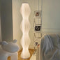 Modern Sculptural Floor Lamp with Wave Shaped Design and Soft White Glow for Living Room or Studio Decor