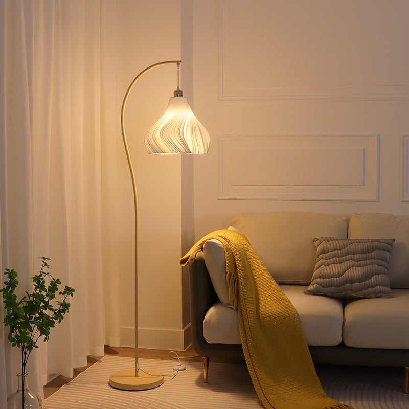 Elegant Floor Lamp with Curved Metal Arm and Swirl Pattern Pendant Shade in Warm Beige for Living Room or Bedroom Ambience