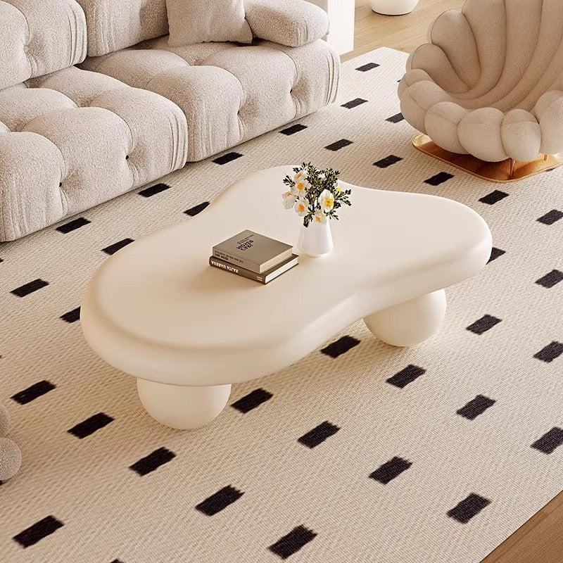 Modern Irregular Shaped Coffee Table with Cream Finish and Sculptural Rounded Legs for Contemporary Living Room or Artistic Lounge Space